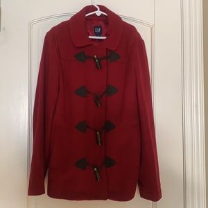 🛍 Classic red wool pea coat with toggle closures and zipper closures.